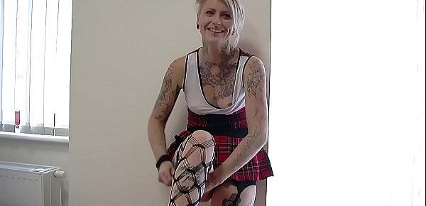  Blonde tattooed chick in a miniskirt teasing